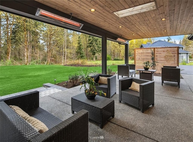 view of patio / terrace featuring an outdoor hangout area and an outbuilding