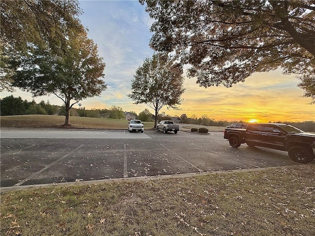 view of parking at dusk