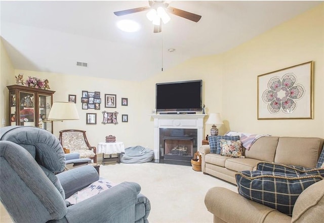 living room featuring ceiling fan and vaulted ceiling