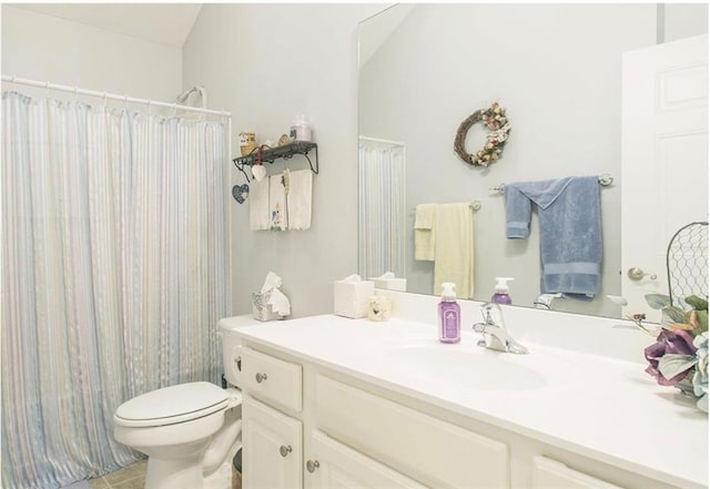 full bathroom with tile patterned flooring, vanity, toilet, and shower / tub combo