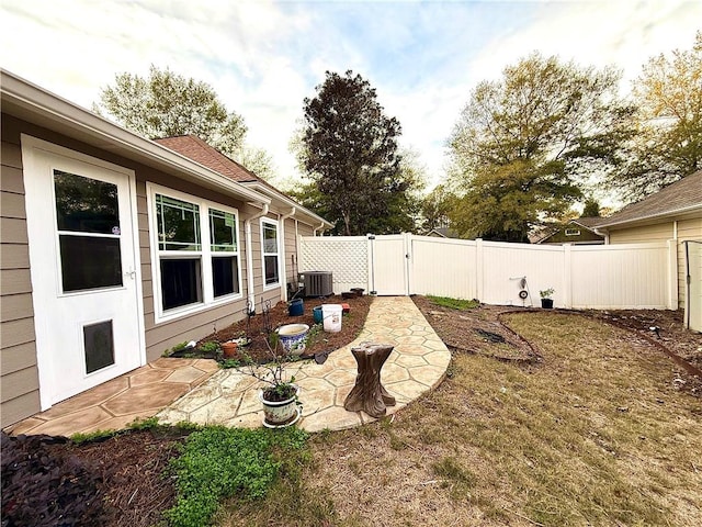 view of yard featuring a patio area and cooling unit