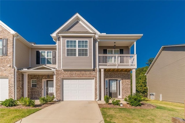 view of front of house featuring a front lawn, a garage, and a balcony