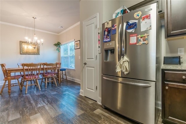 kitchen with dark hardwood / wood-style flooring, stainless steel fridge, pendant lighting, crown molding, and a notable chandelier