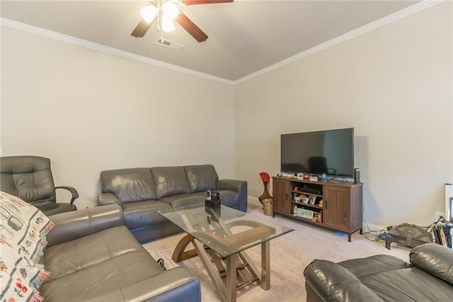 carpeted living room with ceiling fan and ornamental molding