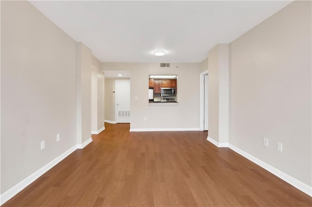 spare room featuring hardwood / wood-style floors