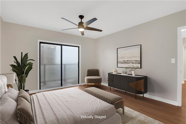 bedroom with ceiling fan and wood-type flooring