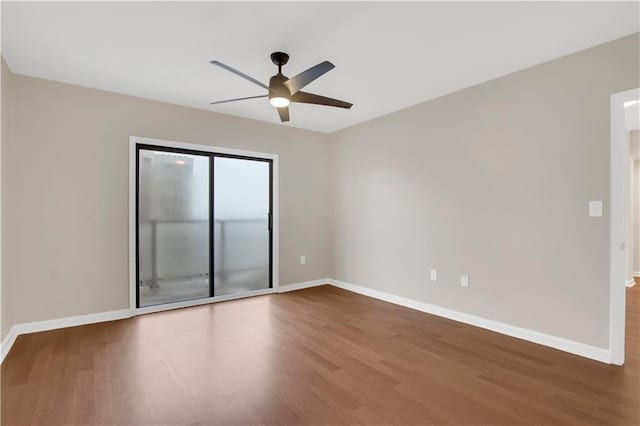 empty room featuring ceiling fan and wood-type flooring