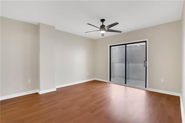 empty room with ceiling fan and wood-type flooring