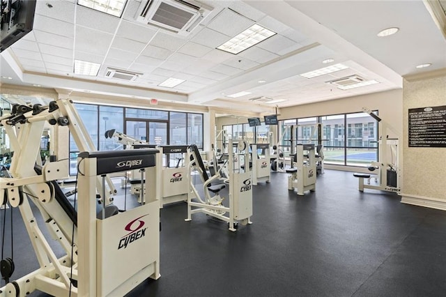 exercise room featuring a drop ceiling