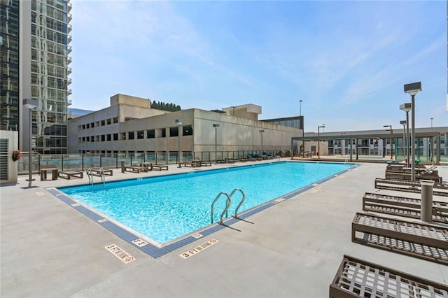 view of swimming pool featuring a patio