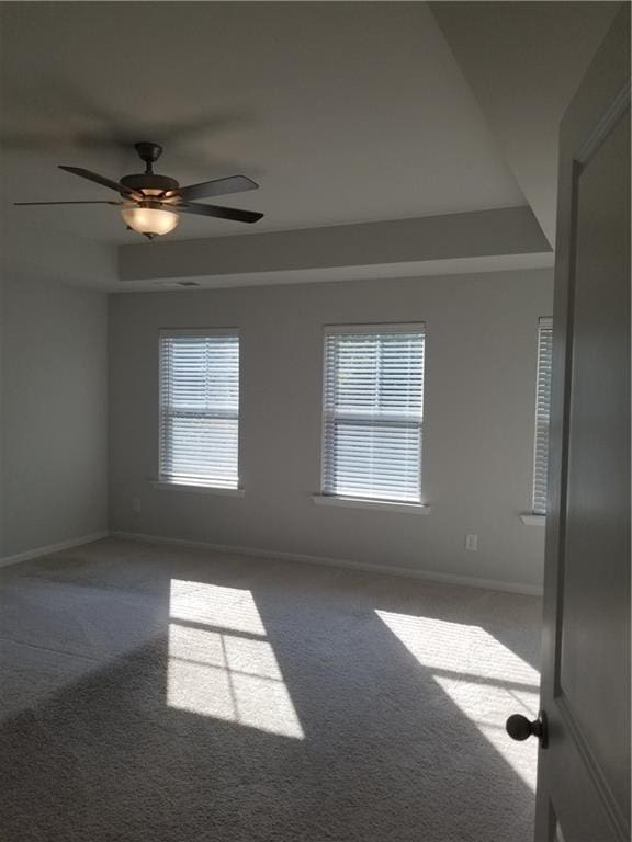 7298 Rockhouse Rd Unit 5, Austell, GA 30168 - carpeted empty room with baseboards, ceiling fan, and a raised ceiling