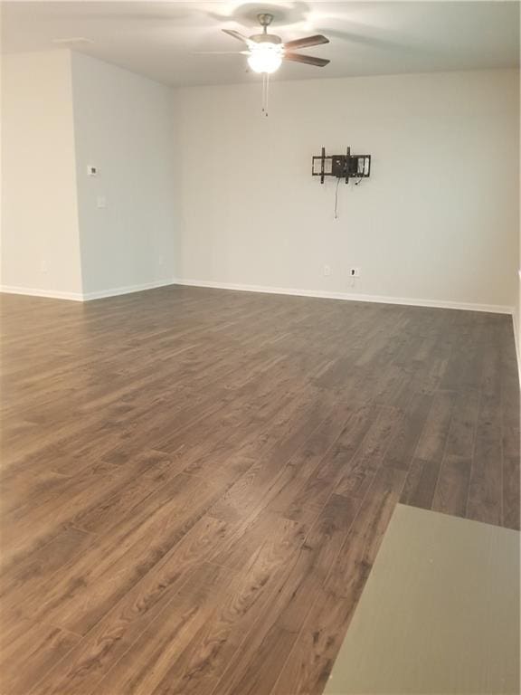7298 Rockhouse Rd Unit 5, Austell, GA 30168 - unfurnished room featuring ceiling fan, dark wood finished floors, and baseboards