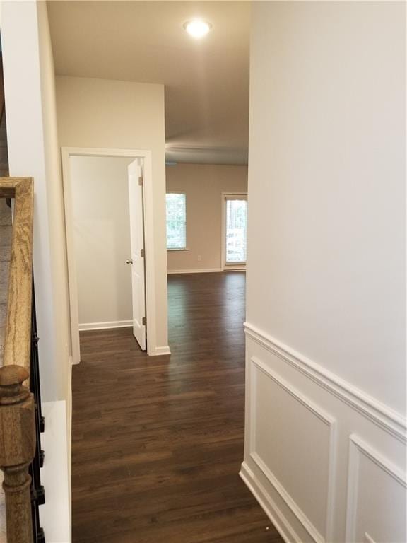 corridor featuring dark hardwood / wood-style flooring