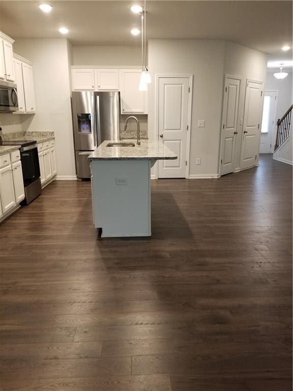 7298 Rockhouse Rd Unit 5, Austell, GA 30168 - kitchen featuring stainless steel appliances, a sink, light stone countertops, recessed lighting, and baseboards