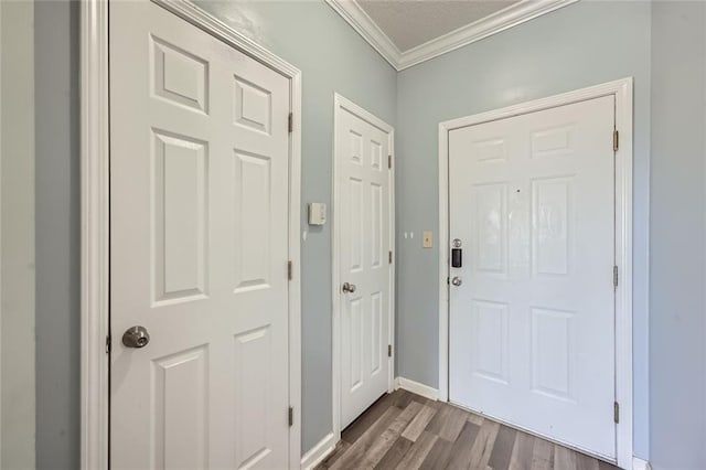 doorway to outside featuring crown molding and hardwood / wood-style flooring