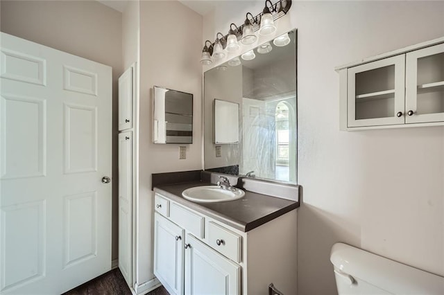 bathroom featuring vanity and toilet