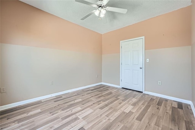 unfurnished room featuring ceiling fan, a textured ceiling, and light hardwood / wood-style flooring