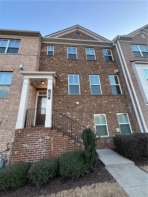 view of front of home with brick siding