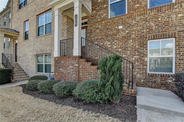 property entrance with brick siding