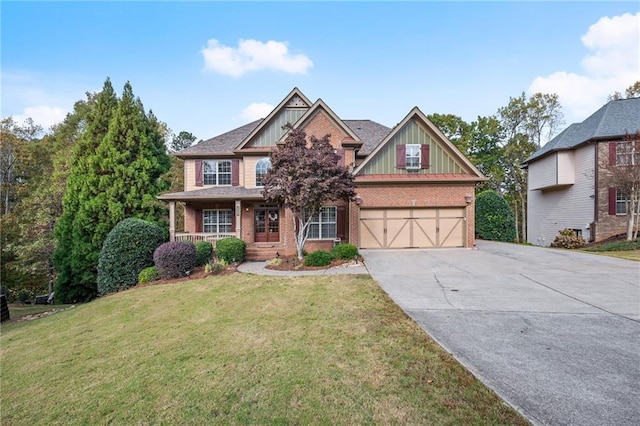 craftsman-style house featuring a front lawn, a porch, and a garage