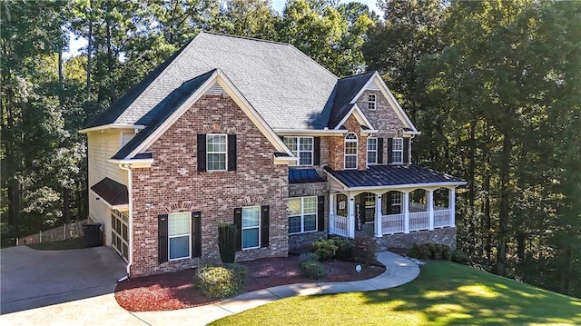 view of front of house with a front yard and a garage