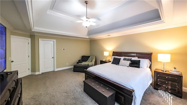 bedroom with light carpet, ornamental molding, a tray ceiling, and ceiling fan