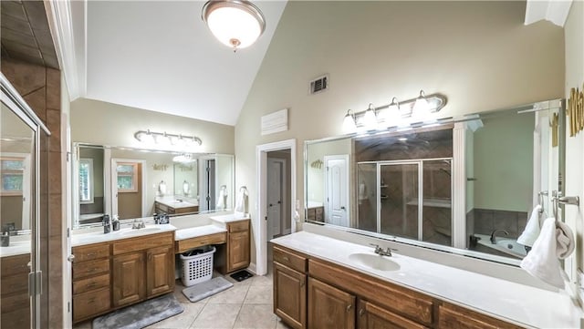 bathroom with vanity, high vaulted ceiling, tile patterned floors, and plus walk in shower