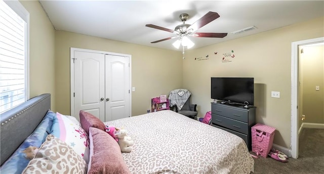 bedroom with a closet, carpet floors, and ceiling fan