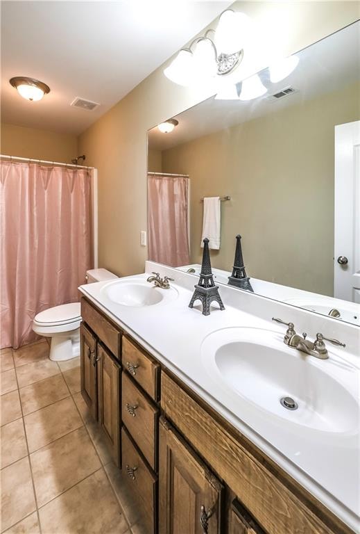 bathroom with vanity, toilet, tile patterned flooring, and a shower with shower curtain