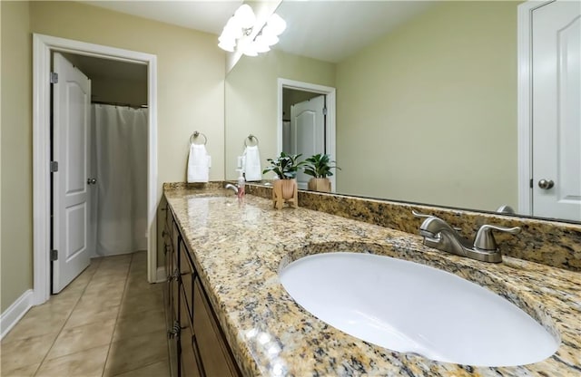 bathroom with vanity and tile patterned flooring