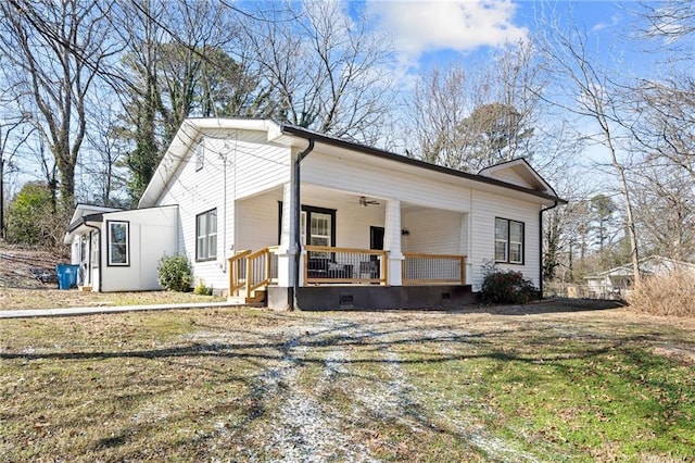 3595 S St NW, Duluth, GA 30096 - view of property exterior with ceiling fan, a lawn, and a porch