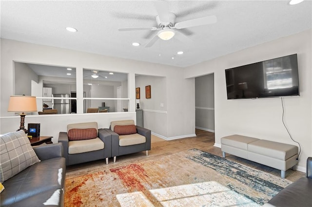 3595 S St NW, Duluth, GA 30096 - living area featuring ceiling fan, wood finished floors, recessed lighting, and baseboards