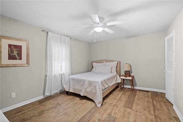 3595 S St NW, Duluth, GA 30096 - bedroom with wood finished floors, baseboards, and ceiling fan