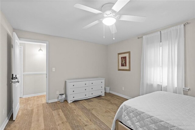 3595 S St NW, Duluth, GA 30096 - bedroom with light wood-style flooring, baseboards, and a ceiling fan
