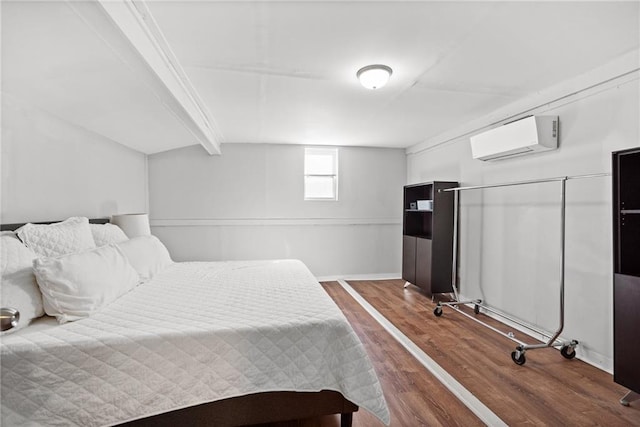 3595 S St NW, Duluth, GA 30096 - bedroom with a wall mounted air conditioner, dark wood finished floors, and baseboards