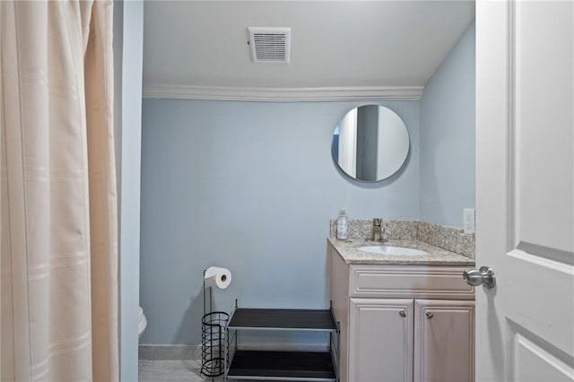 3595 S St NW, Duluth, GA 30096 - bathroom featuring vanity, ornamental molding, toilet, and tile patterned flooring