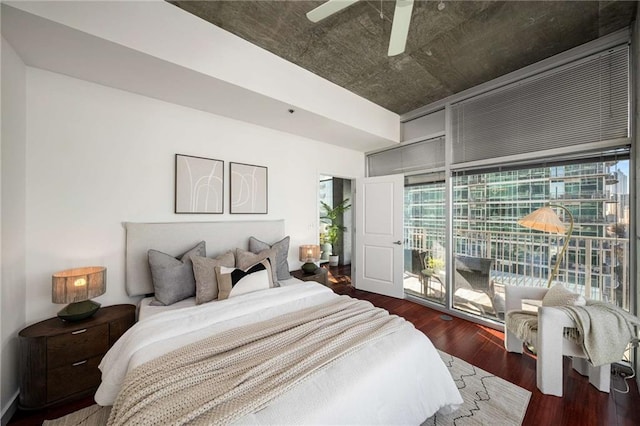 bedroom featuring access to outside, a ceiling fan, and wood finished floors