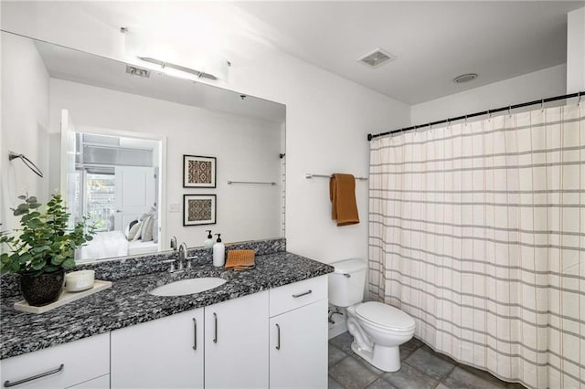 ensuite bathroom featuring visible vents, toilet, connected bathroom, and vanity