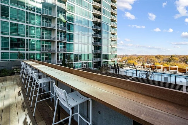 balcony featuring outdoor dry bar