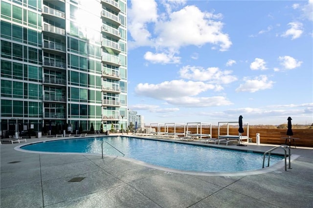 pool with a patio area