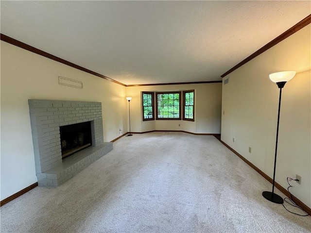 unfurnished living room featuring light carpet, crown molding, baseboards, and a fireplace