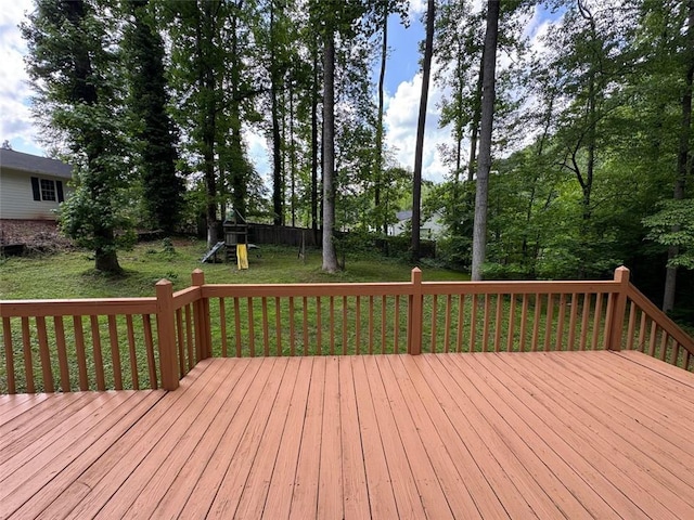 wooden terrace featuring a playground