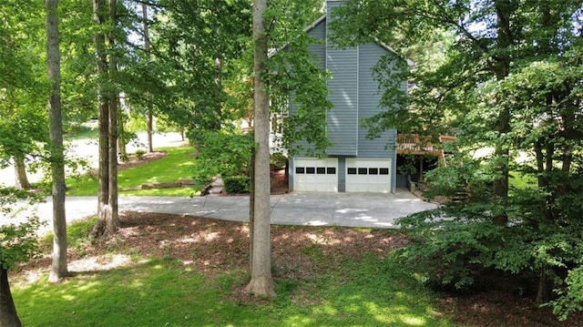 5307 Red Rock Trce, Powder Springs, GA 30127 - view of side of home featuring an attached garage and concrete driveway