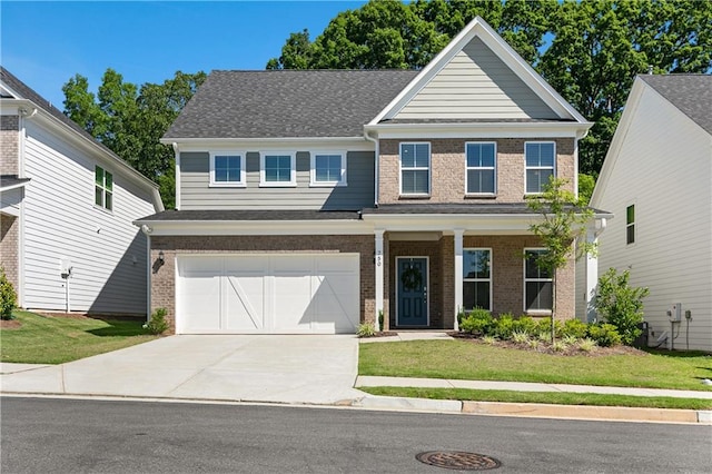 view of front facade featuring a garage and a front lawn