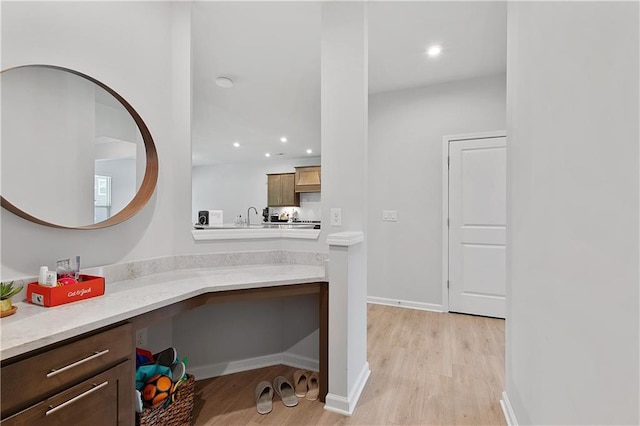 bathroom with vanity and hardwood / wood-style floors