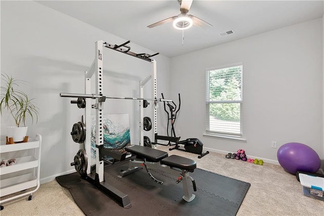 workout room with carpet and ceiling fan