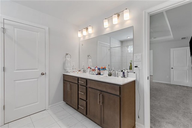 bathroom featuring walk in shower and vanity