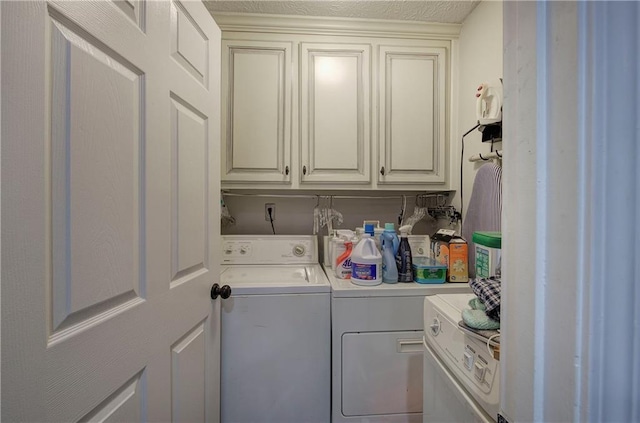 laundry area featuring cabinet space and independent washer and dryer