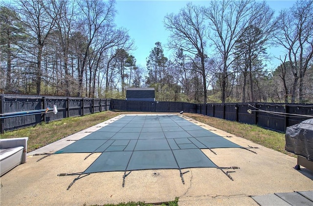 view of pool featuring a patio and a fenced backyard