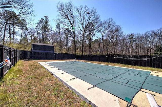 view of swimming pool featuring a yard, a fenced in pool, and a fenced backyard